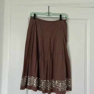 Chocolate brown dirndl skirt with sequined trim.